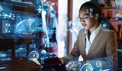 woman at a computer with artificial intelligence/digital overlay