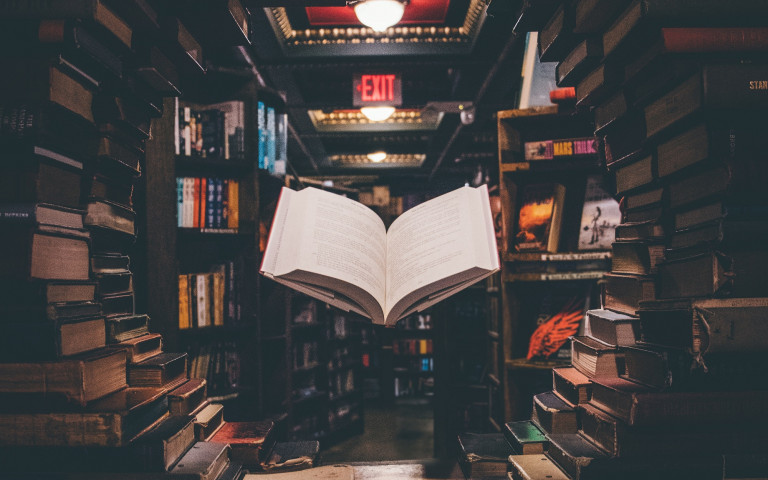floating open book in a library