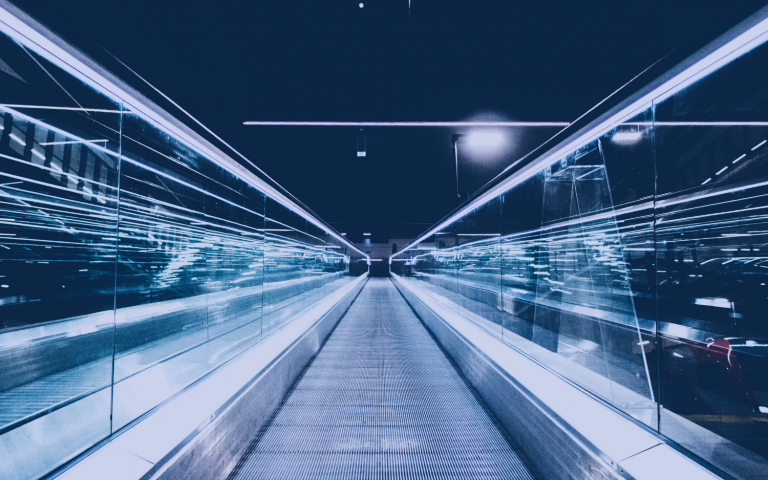 moving forward on a silver-hued travelator